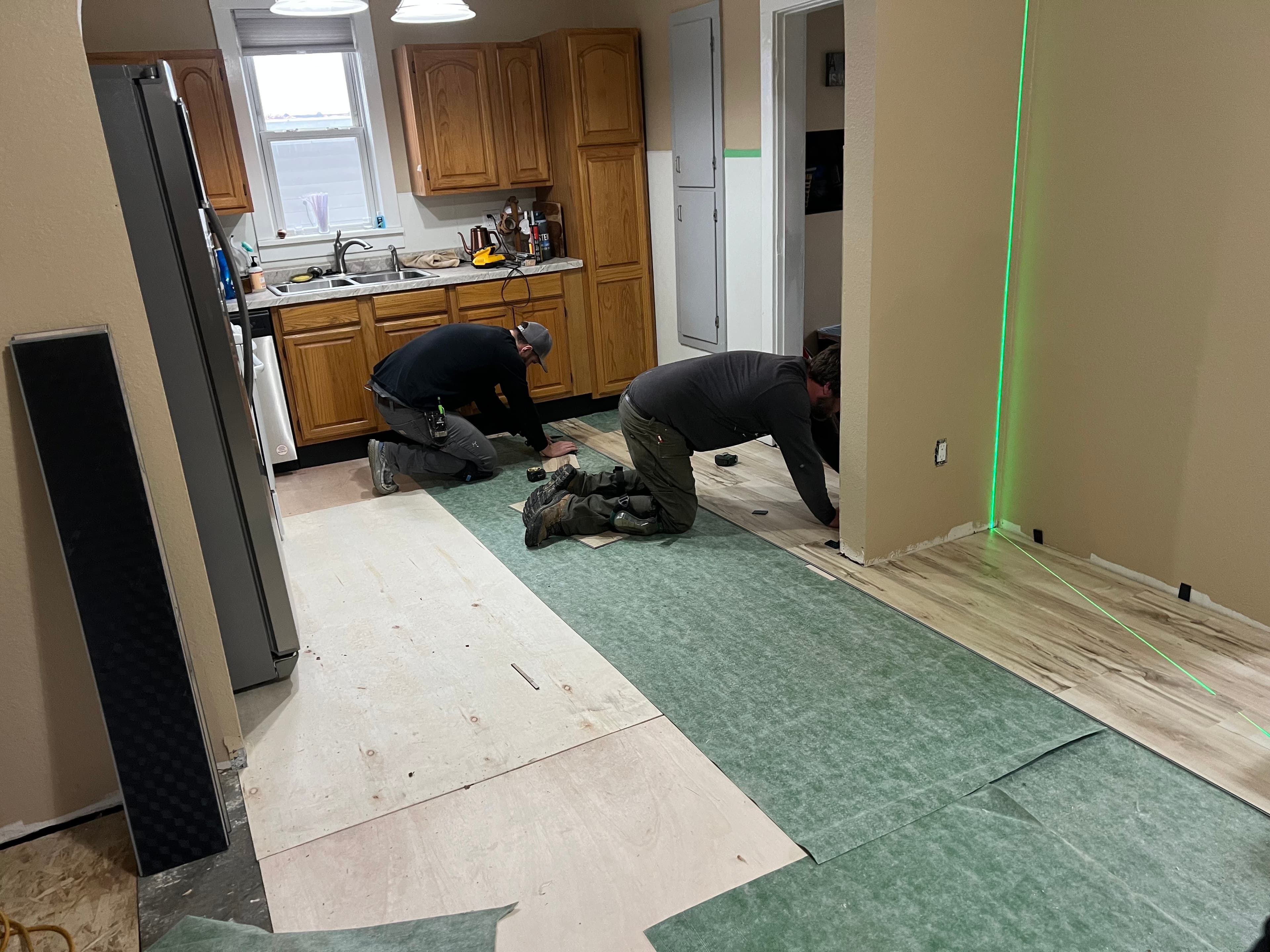 Team installing flooring